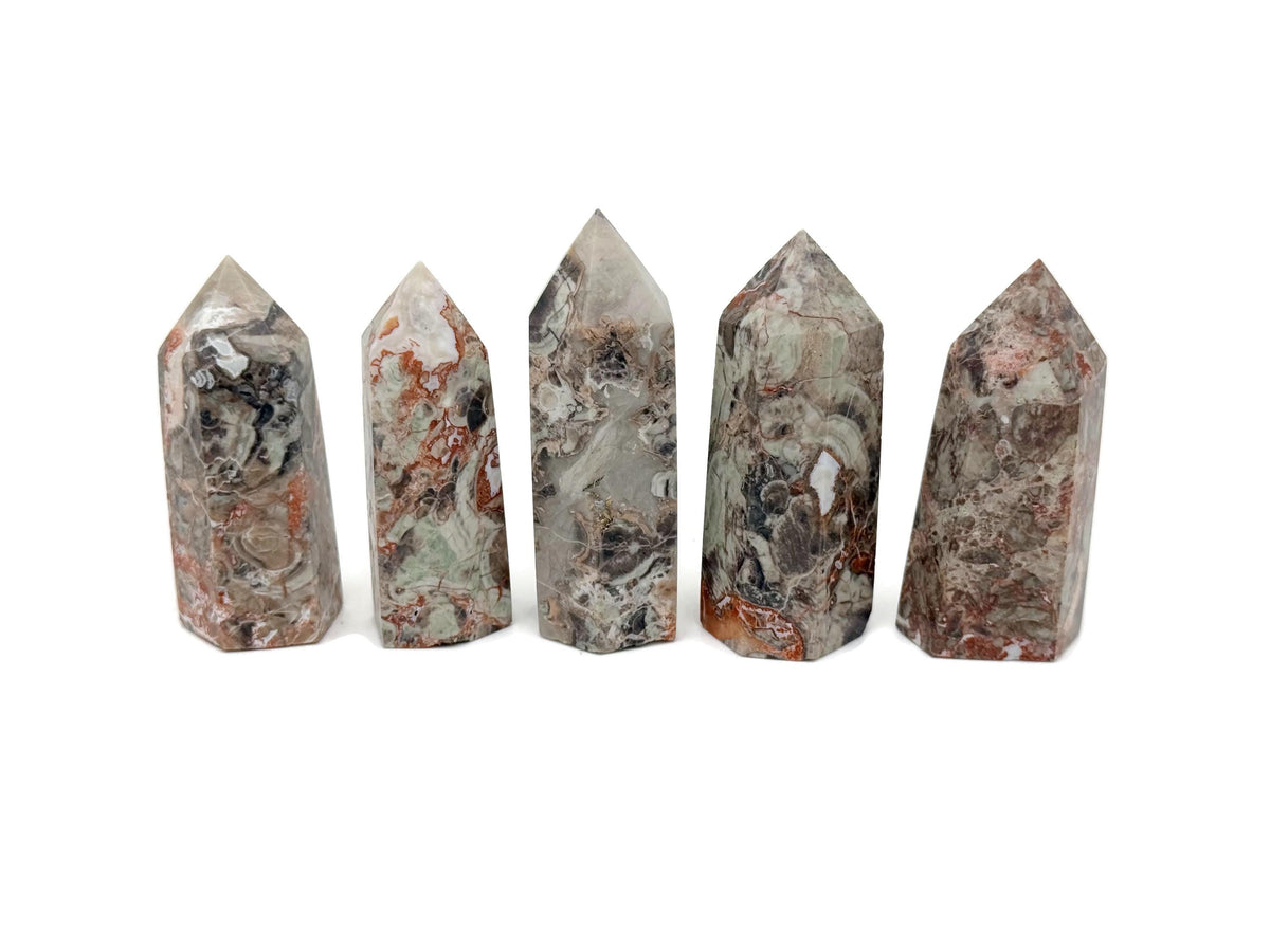 Leopard skin jasper obelisk tower crystal by GemstoneGO, featuring a polished, natural stone with distinctive spotted pattern.