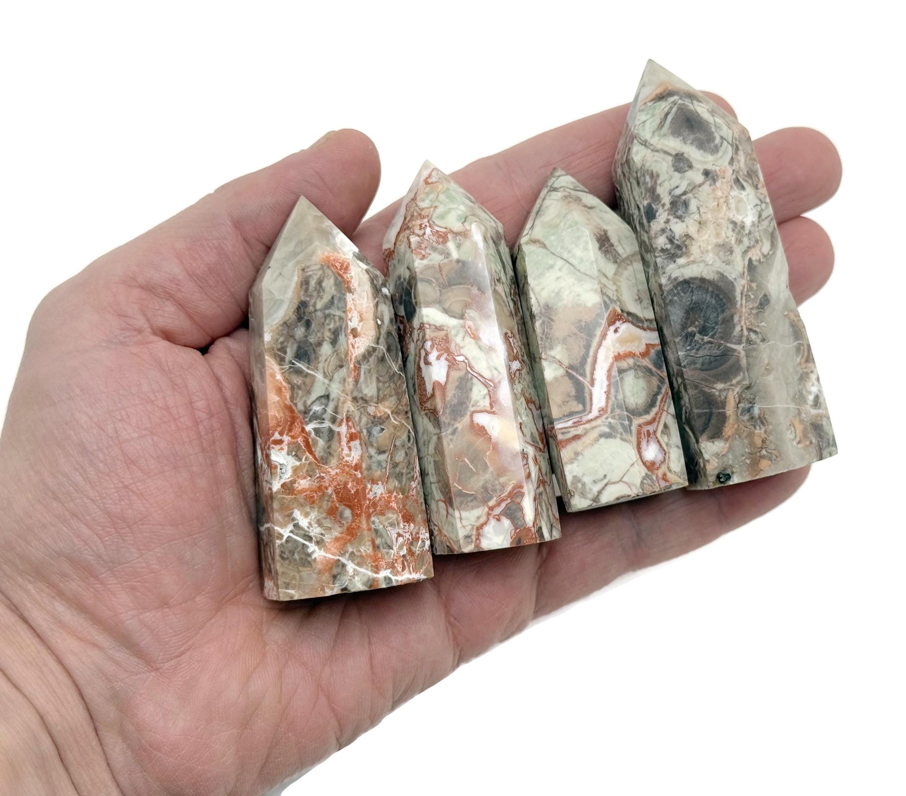 Leopard skin Jasper obelisk tower crystal from GemstoneGO, showcasing a natural stone with distinctive leopard print patterns.