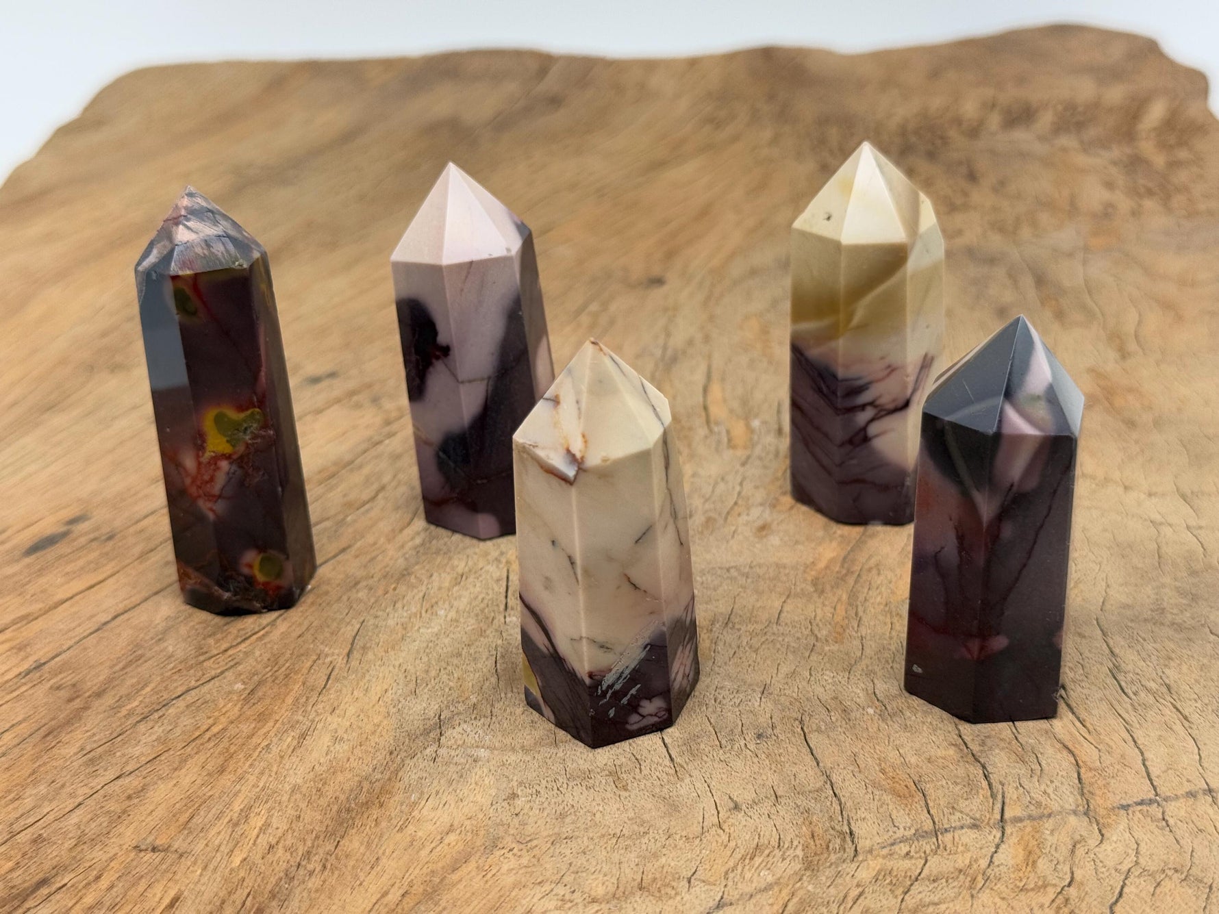 Mookaite Jasper obelisk tower crystal from GemstoneGO, showcasing rich earthy tones and polished stone shape.