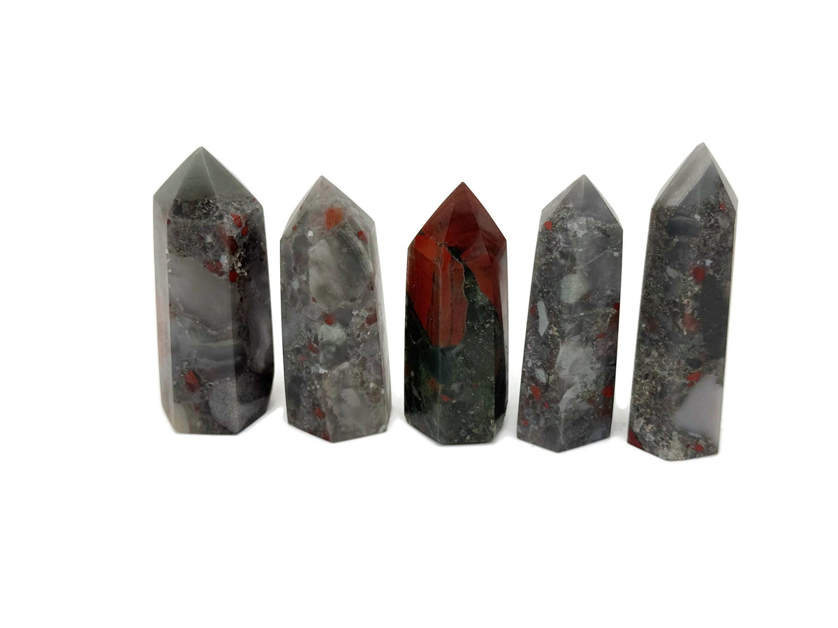 African Bloodstone obelisk tower crystal from GemstoneGO, featuring a deep green stone with red veining and a polished obelisk shape.