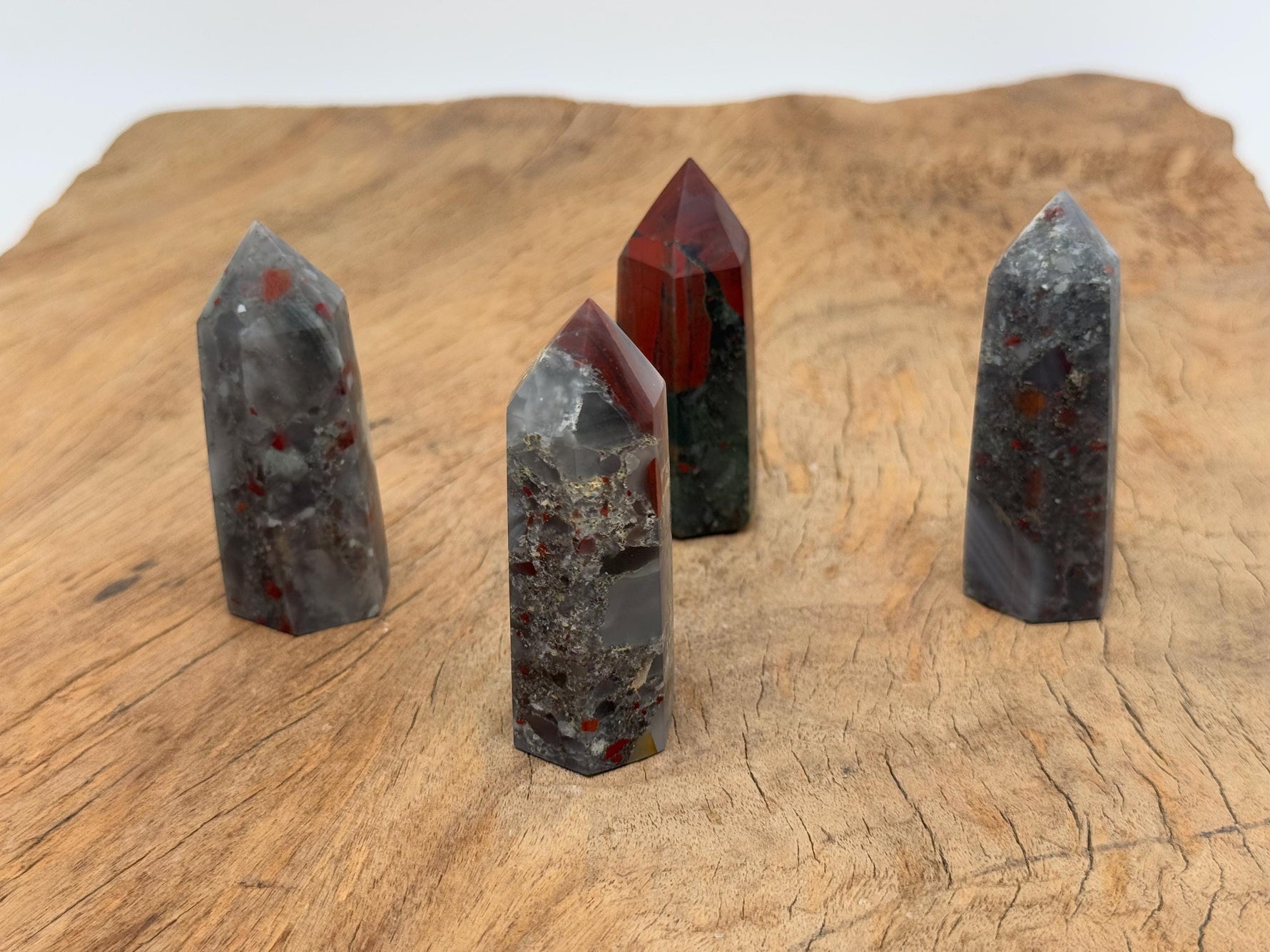African Bloodstone obelisk tower crystal from GemstoneGO, showcasing a dark green stone with red blood-like mineral veins.