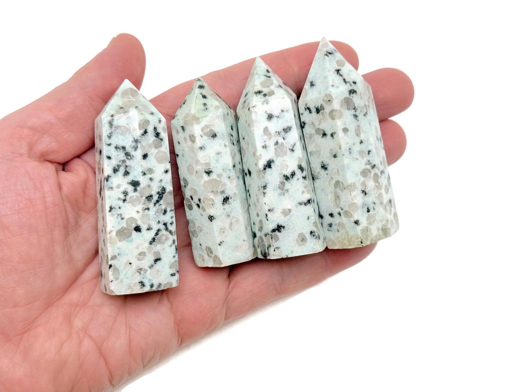 Kiwi Jasper obelisk tower crystal from GemstoneGO, smooth polished gemstone with natural green and brown patterns, standing upright.