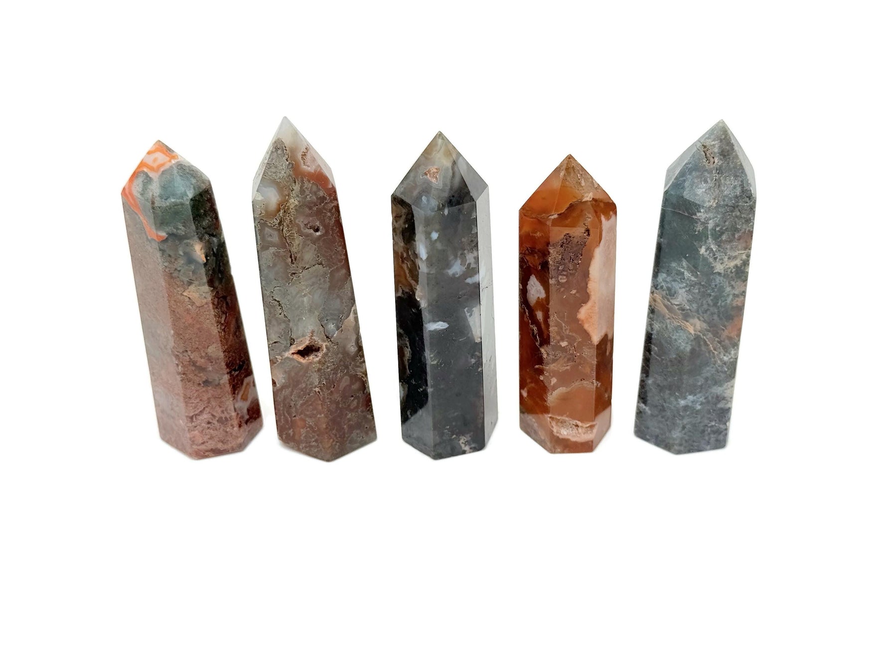 Water Grass Agate obelisk tower crystal from GemstoneGO, showing a detailed, polished green and brown banded stone sculpture.