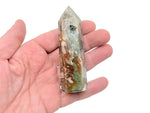 Water grass agate obelisk tower crystal from GemstoneGO, showcasing vibrant green and intricate natural banding on a polished stone.