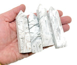 Mexican White Agate obelisk tower crystal by GemstoneGO, featuring smooth polished surface and natural stone patterns.