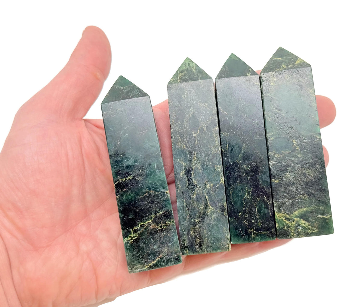 Emerald quartz obelisk tower crystal from GemstoneGO, showcasing a vibrant green gemstone with a polished, pointed crystal design.