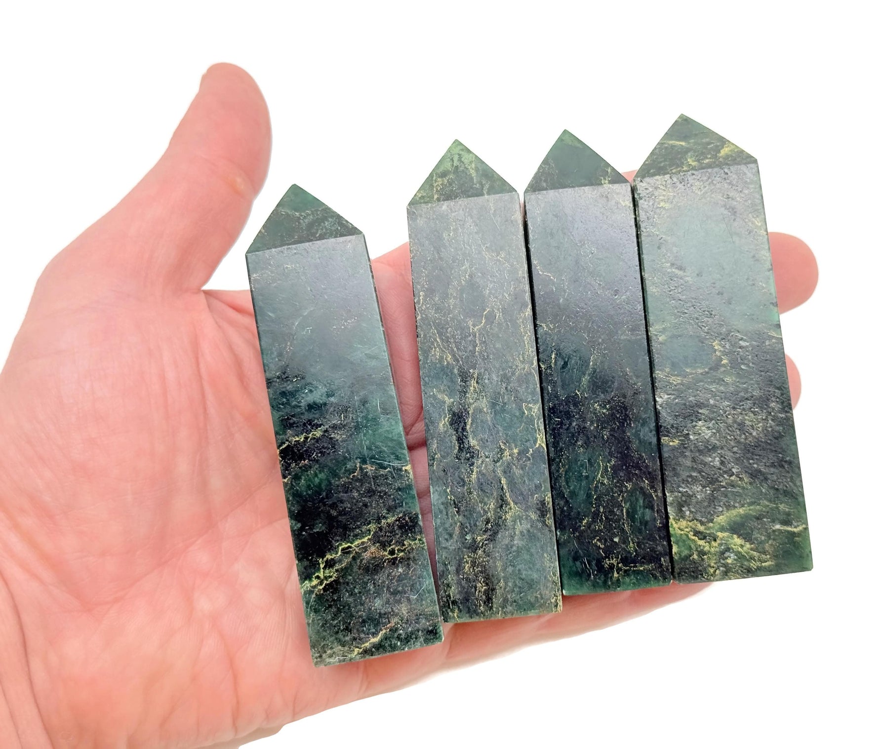 Emerald quartz obelisk tower crystal from GemstoneGO, showcasing a vibrant green gemstone with a polished, pointed crystal design.