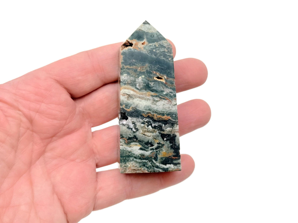 Ocean Jasper obelisk tower crystal by GemstoneGO, showcasing a polished, multicolored gemstone with natural patterns and smooth facets.