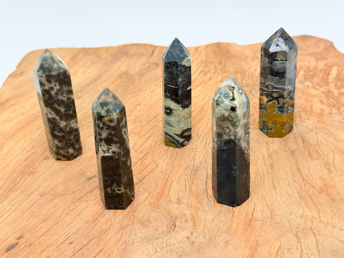 Ocean Jasper obelisk tower crystal from GemstoneGO, showcasing vibrant colors and polished stone with natural patterns.