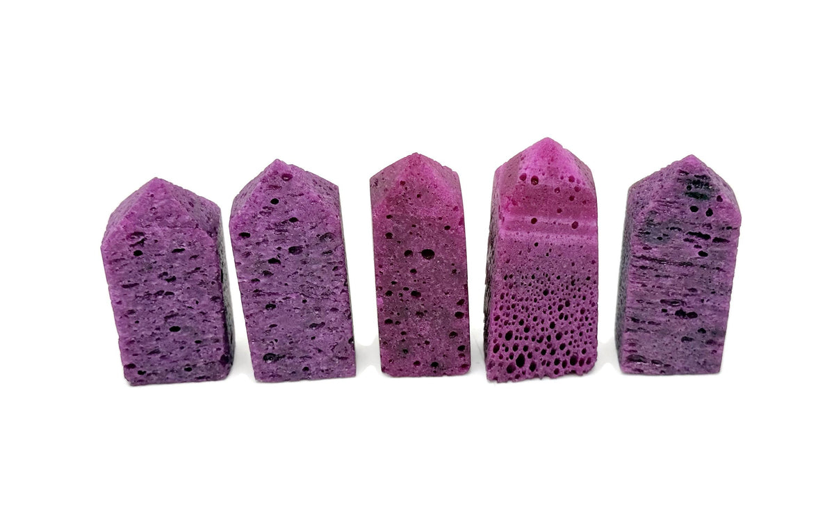 Red Corundum obelisk tower crystal from GemstoneGO, featuring a polished red gemstone obelisk with natural crystal clarity.