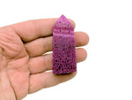 Red corundum obelisk tower crystal from GemstoneGO showcasing a pointed, polished red gemstone with natural crystal features.