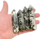 Green Lepidolite obelisk tower crystal from GemstoneGO, showcasing a polished, vibrant green mineral with natural striations.