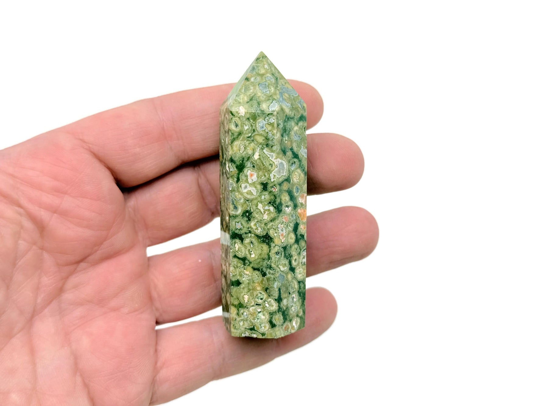 Rhyolite obelisk tower crystal from Rainforest collection by GemstoneGO, featuring a polished, natural stone with a pointed tip.