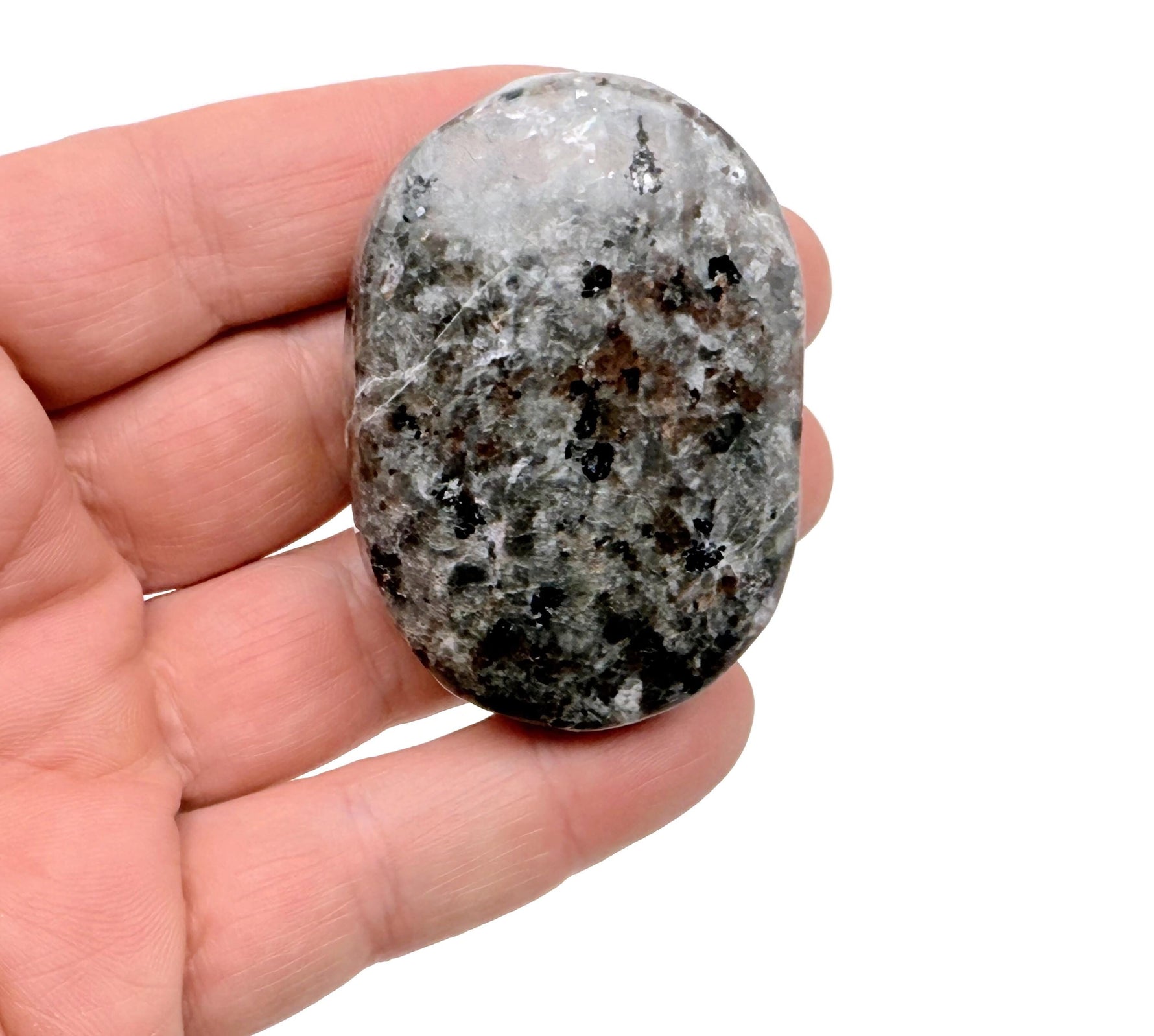 Yooperlite palm gemstone featuring fluorescent sodalite spa stone with vibrant blue glow, ideal for meditation or decorative display.