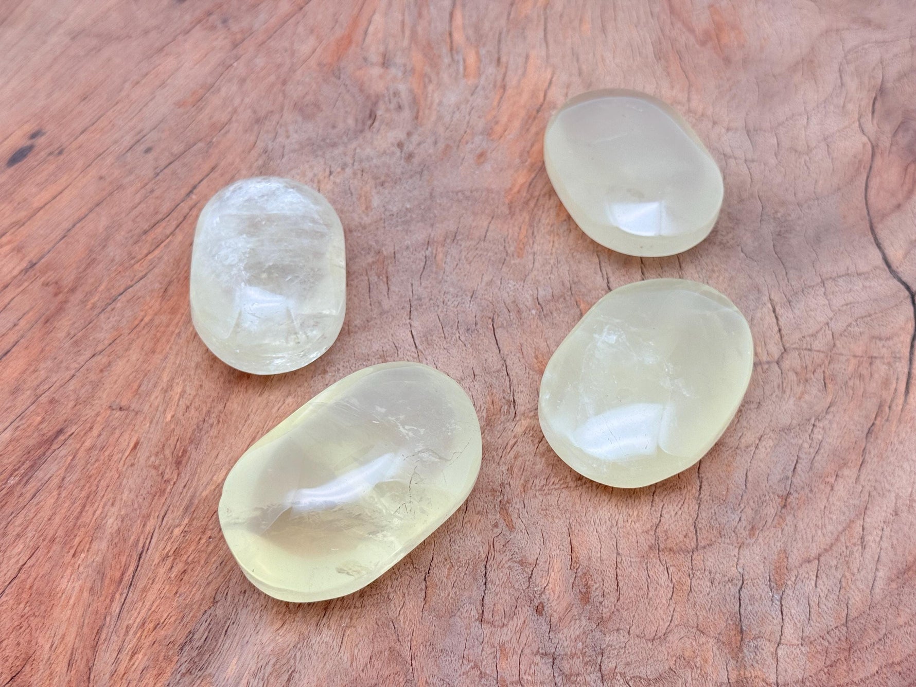 Citrine palm gemstone spa stone by GemstoneGO, smooth yellow citrine crystal used for relaxation and massage therapy.