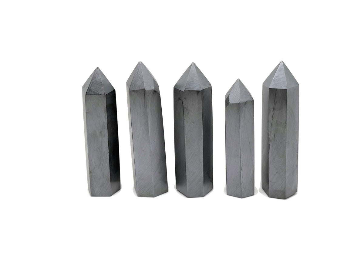 GemstoneGO Terahertz Obelisk Tower Crystal with polished black and gold accents, showcasing intricate gemstone details and smooth surface.