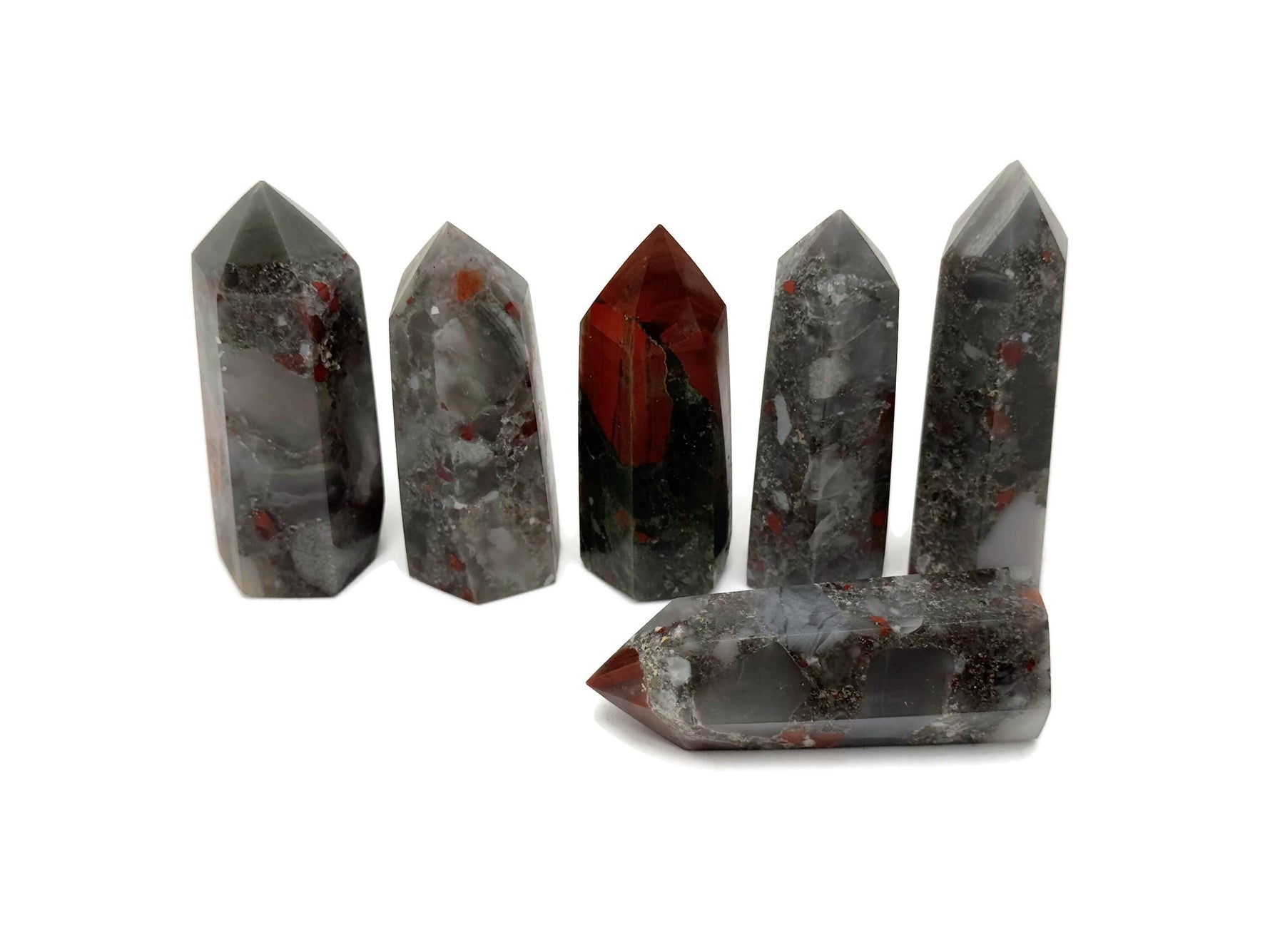 African Bloodstone obelisk tower crystal from GemstoneGO with deep green and red mineral details on a white background
