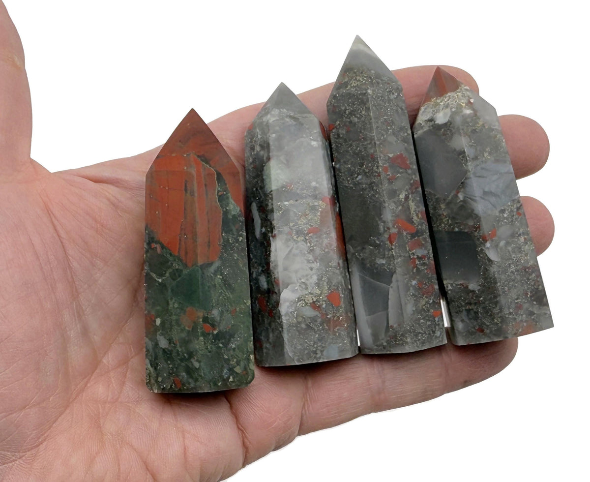 African Bloodstone obelisk tower crystal from GemstoneGO with a deep green and red speckled appearance, polished for display.