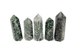 Green Jade Obelisk Tower crystal from GemstoneGO, featuring a polished Qinghai Jade gemstone with a smooth, tapered obelisk shape.