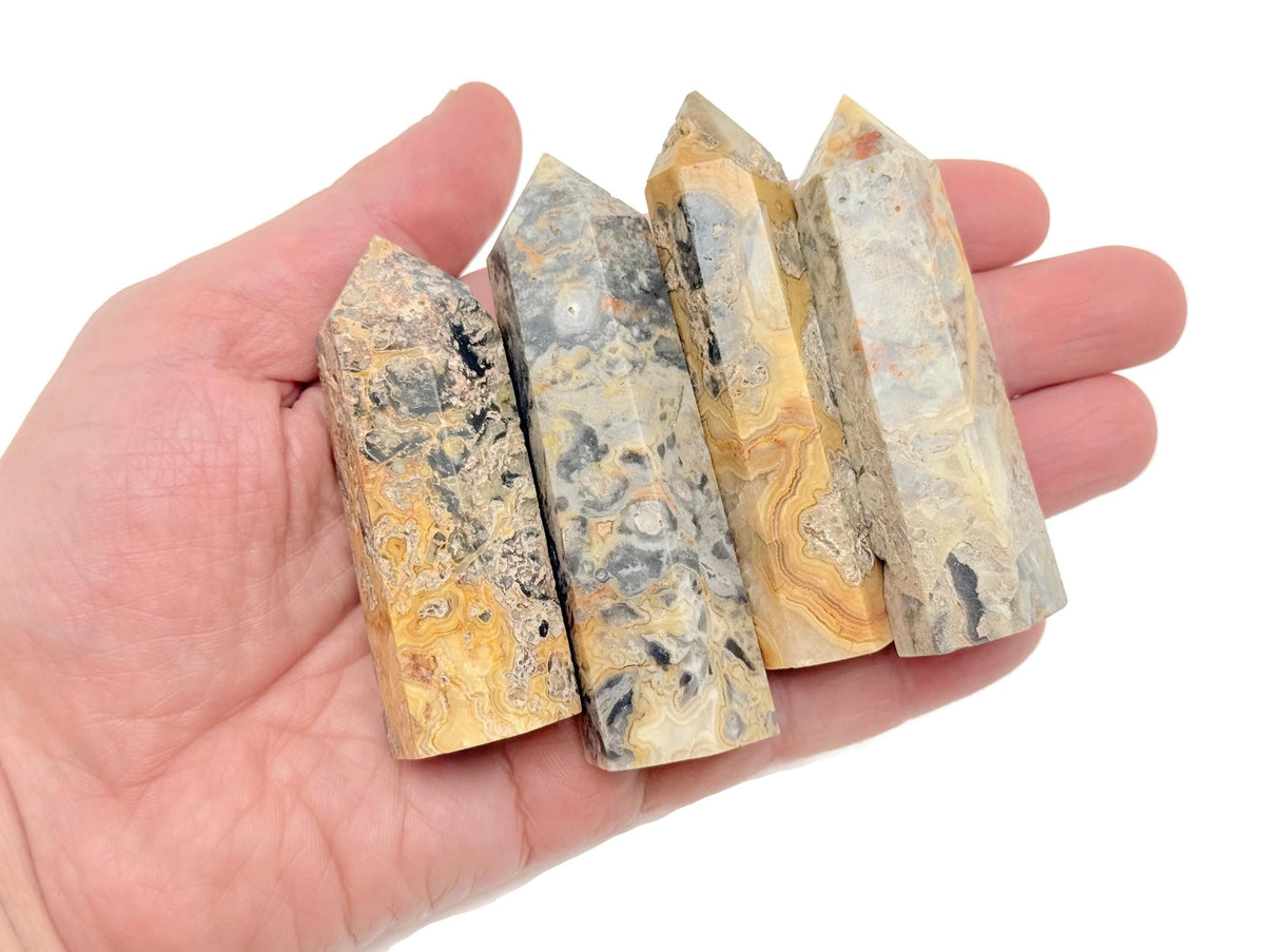 Crazy Lace Agate obelisk tower crystal from GemstoneGO showing vibrant banded patterns and smooth polished surface.