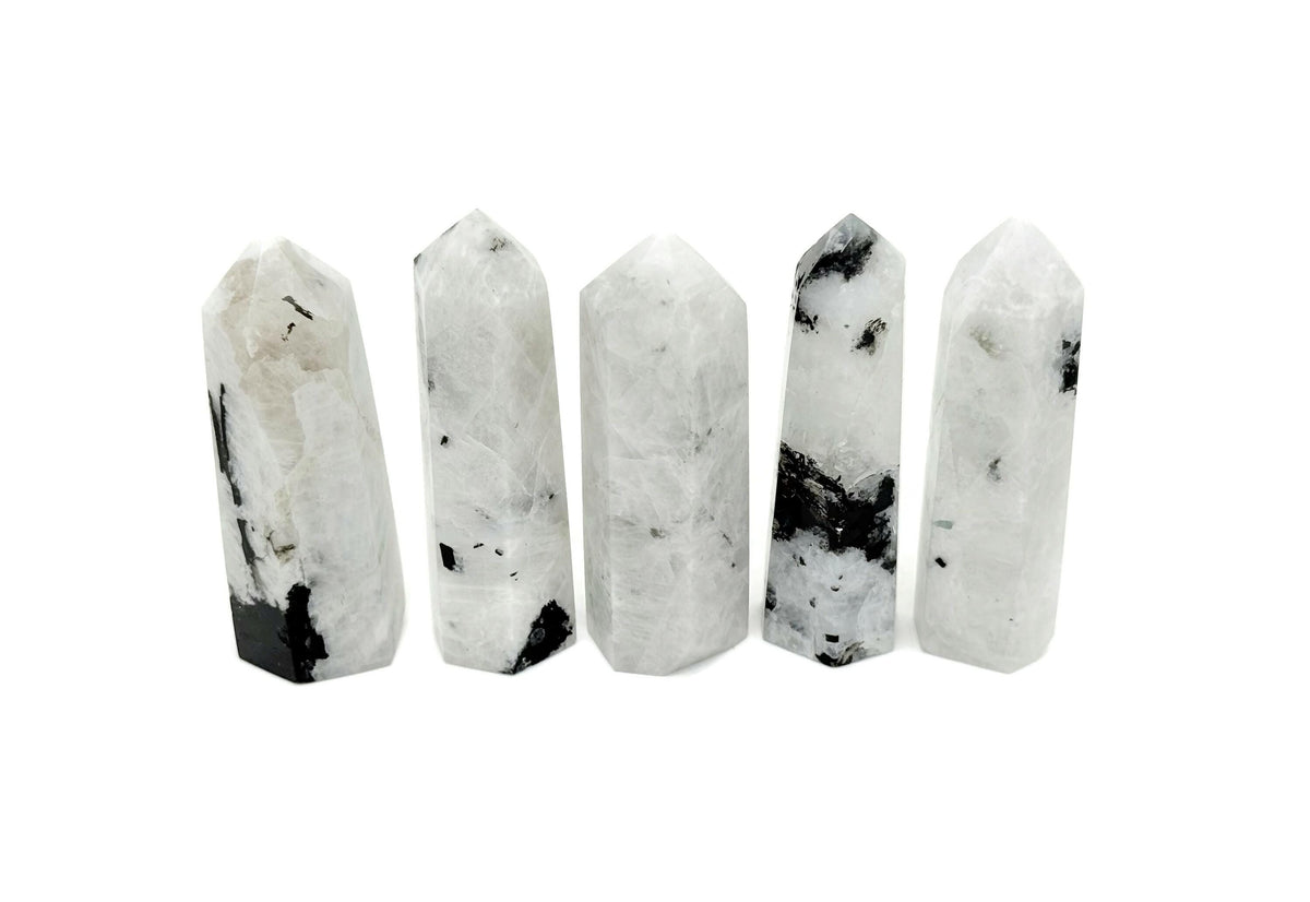 Rainbow Moonstone obelisk tower crystal from GemstoneGO, showcasing a polished, luminous gemstone with natural shimmer and striations.