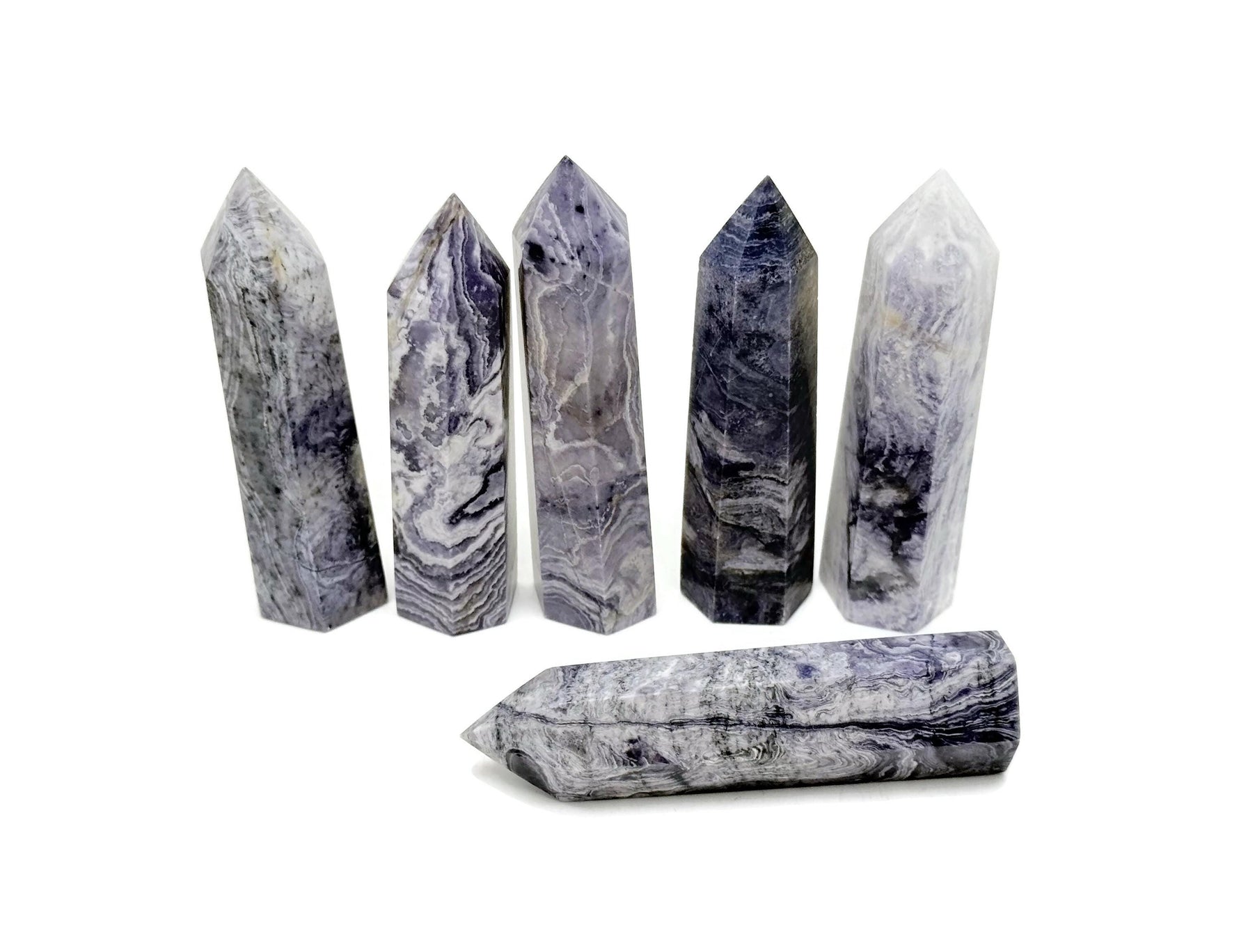 Purple Lavender Lace Agate obelisk tower crystal from GemstoneGO, showcasing a polished purple and lavender stone with intricate natural patterns.