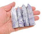 Purple lavender lace agate obelisk tower crystal from GemstoneGO, featuring intricate natural lace patterns and a polished pointed top.