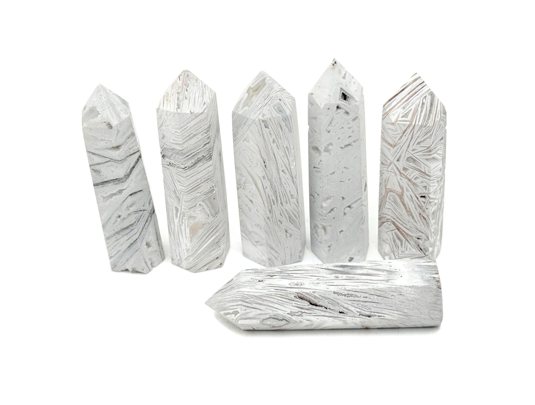 Mexican White Agate obelisk tower crystal by GemstoneGO, showcasing smooth polished surface and natural white veining.