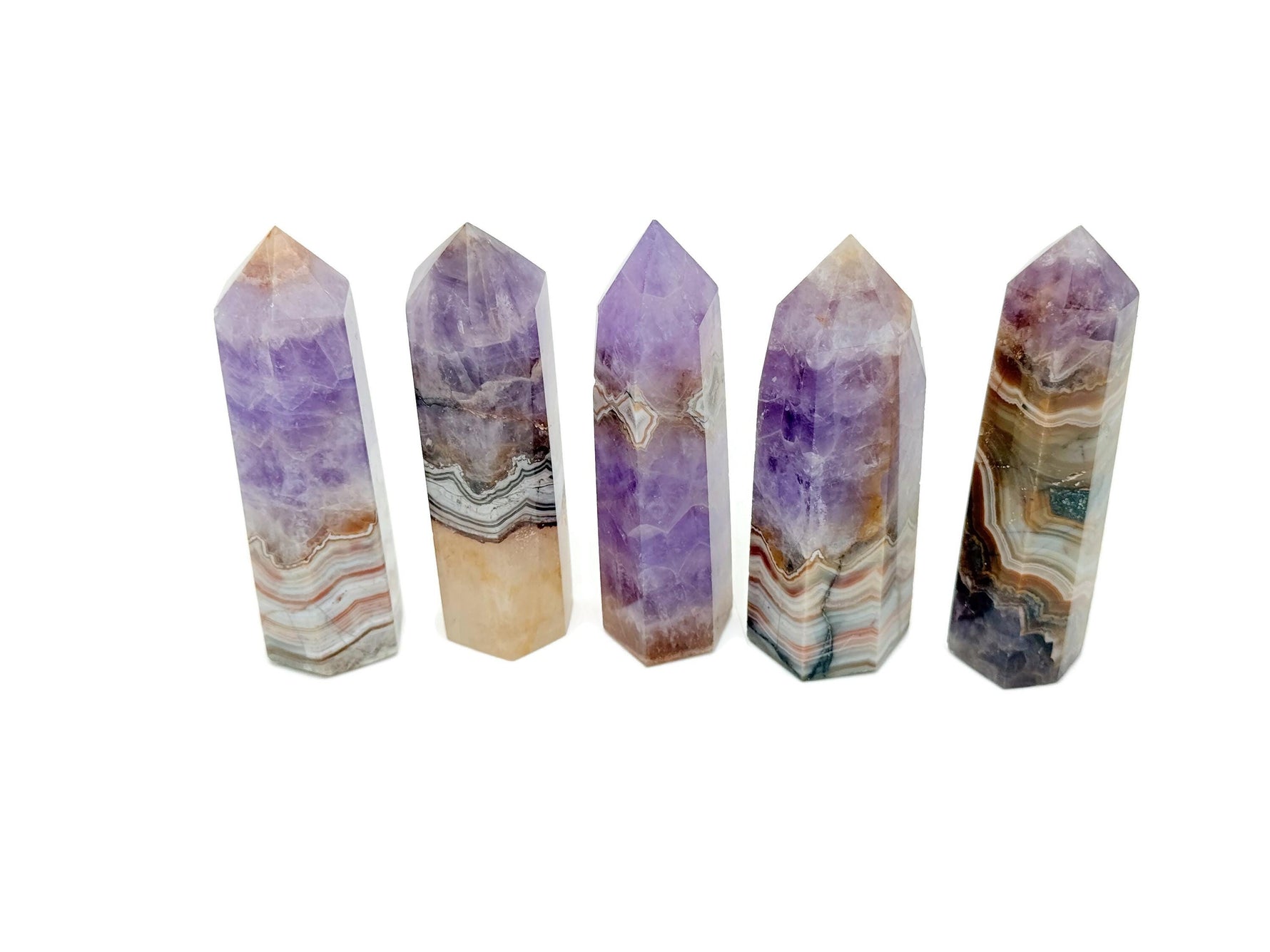 Amethyst and Crazy Lace Agate obelisk tower crystal from GemstoneGO, featuring vibrant purple and intricate gemstone patterns.