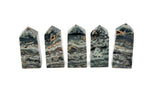 Ocean Jasper obelisk tower crystal from GemstoneGO, featuring colorful, polished stone with natural patterns and a pointed top.