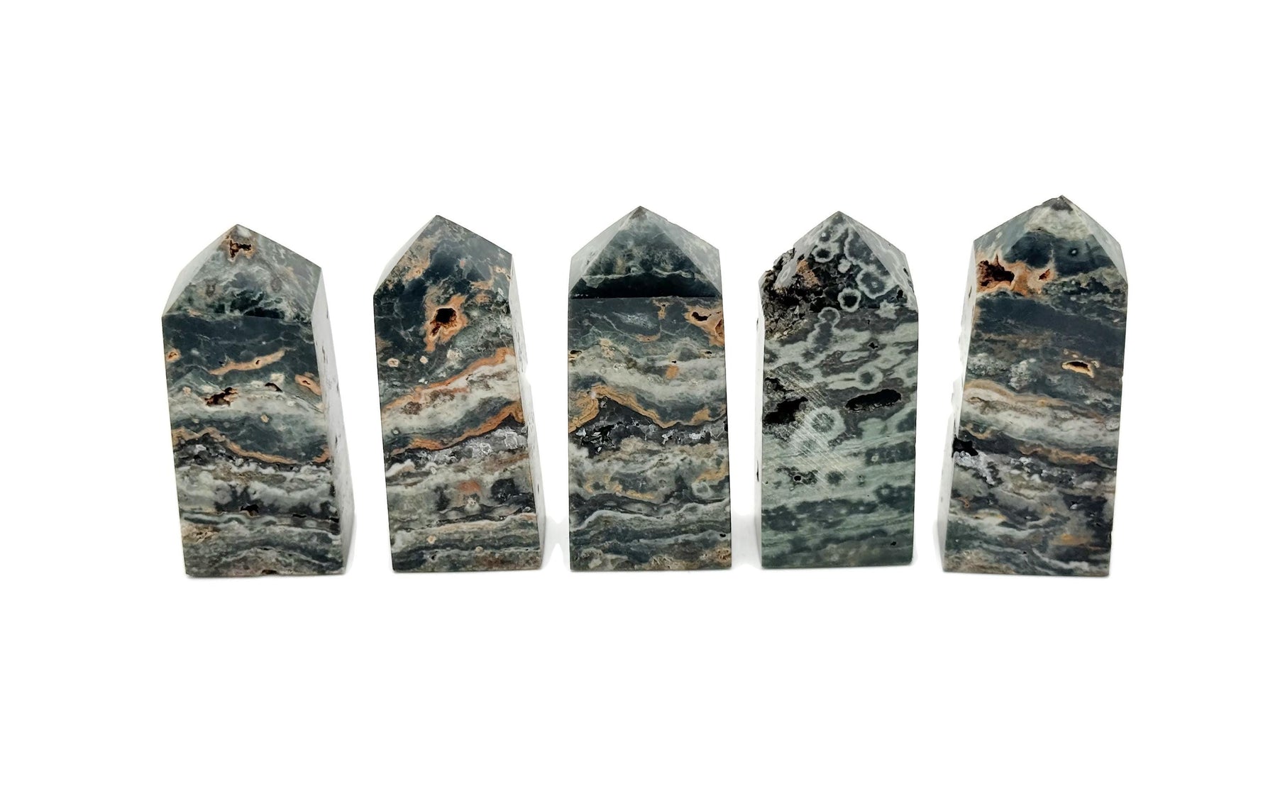 Ocean Jasper obelisk tower crystal from GemstoneGO, featuring colorful, polished stone with natural patterns and a pointed top.