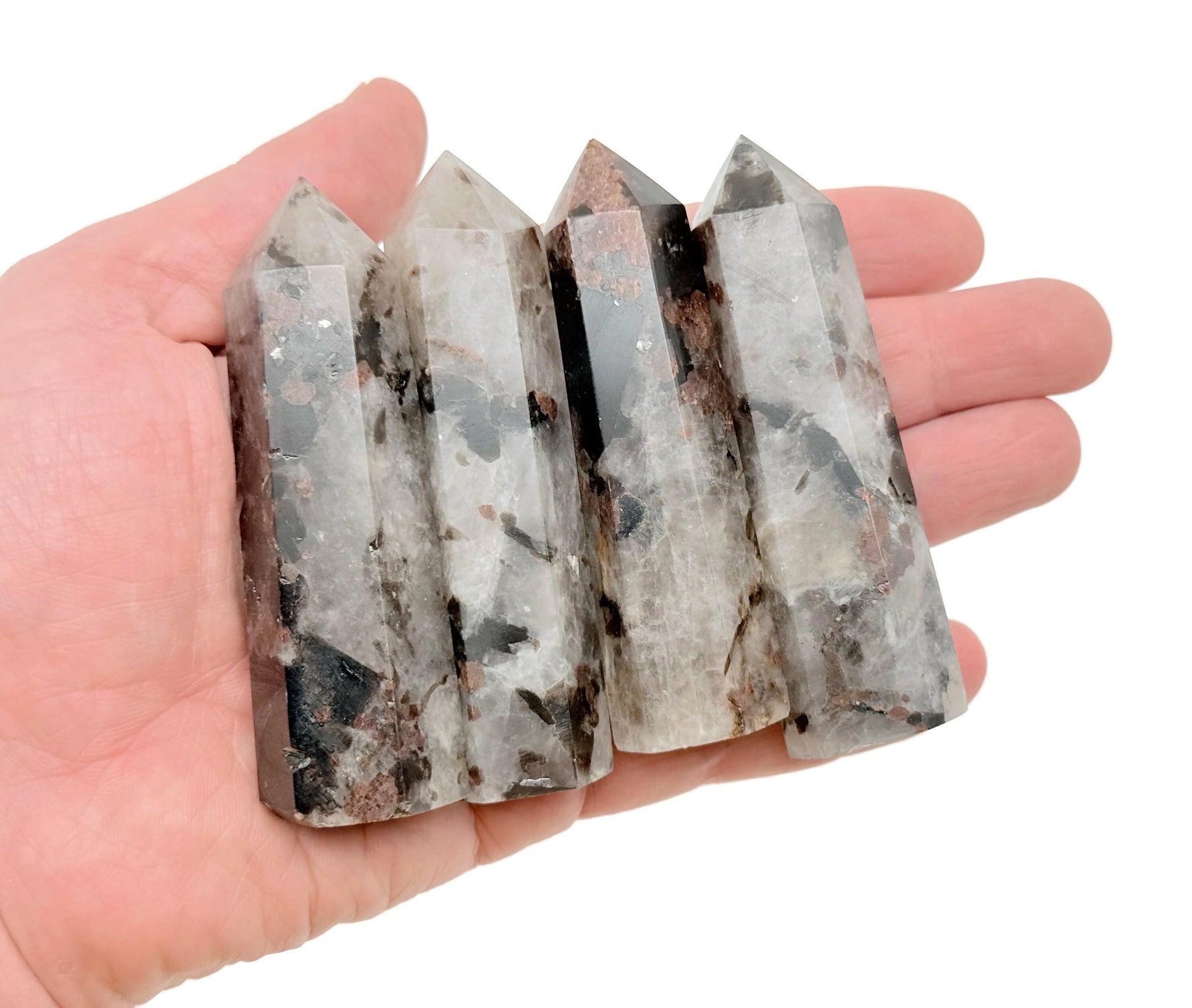 Garnet and black tourmaline obelisk tower crystal from GemstoneGO, showcasing vibrant red garnet and dark tourmaline mineral details.