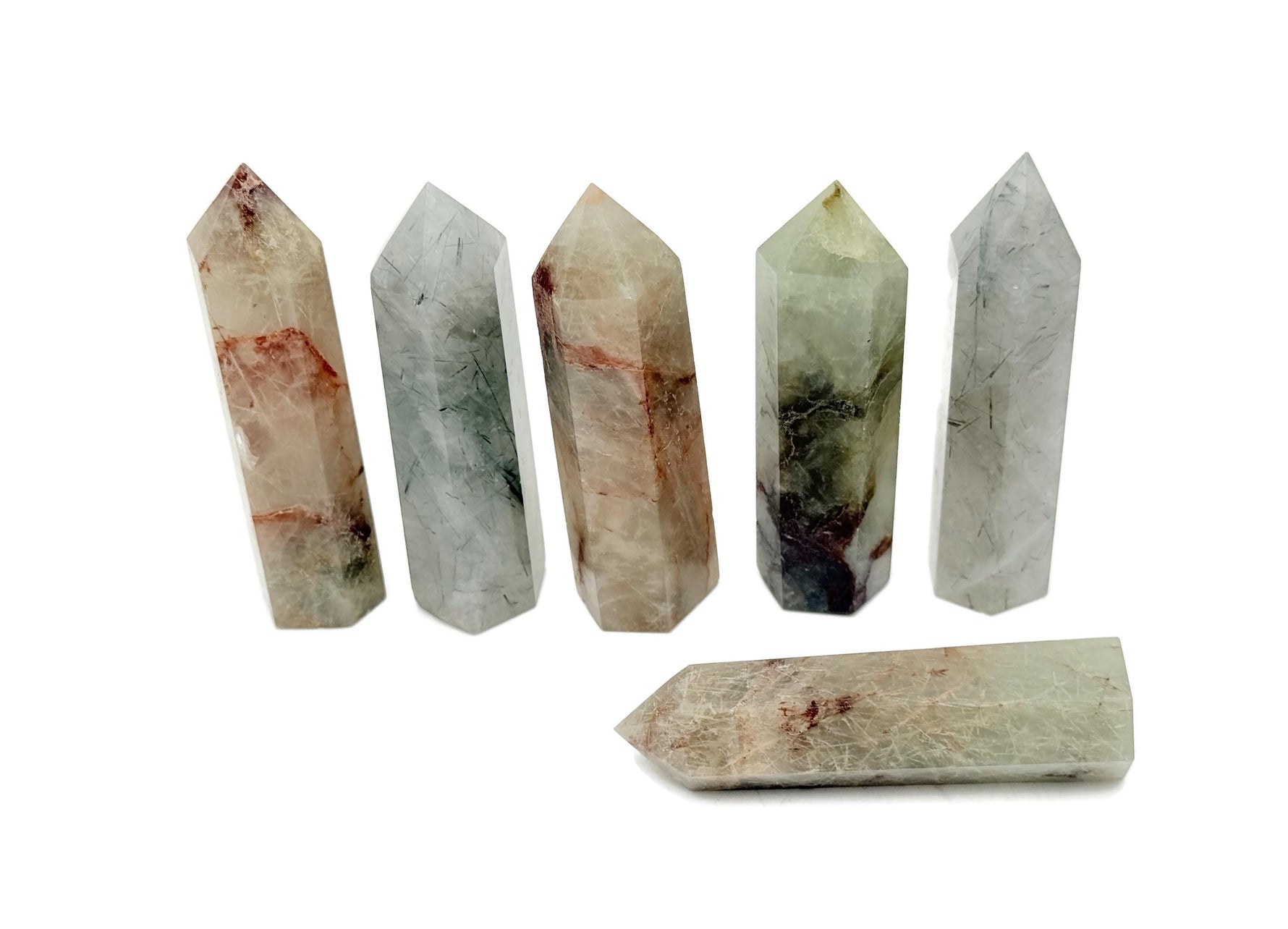 Green rutilated quartz obelisk tower crystal from GemstoneGO, showcasing a polished green quartz stone with golden rutile inclusions.