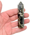 Green Lepidolite obelisk tower crystal from GemstoneGO displayed on a white background.