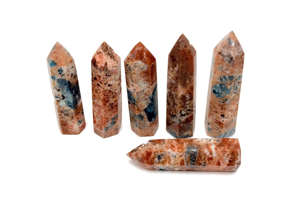 Sunstone and Blue Apatite obelisk tower crystal from GemstoneGO, featuring vibrant orange and blue mineral patterns.