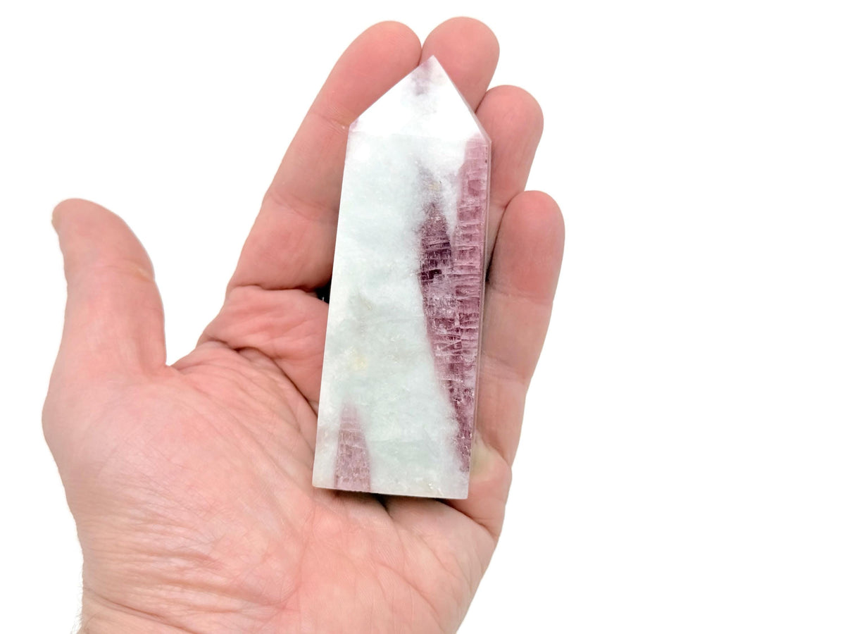 Pink tourmaline obelisk tower crystal from GemstoneGO, showcasing a polished pink gemstone with a pointed obelisk shape.