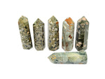Rhyolite Obelisk Tower crystal from GemstoneGO featuring a rainforest green hue and polished gemstone surface.