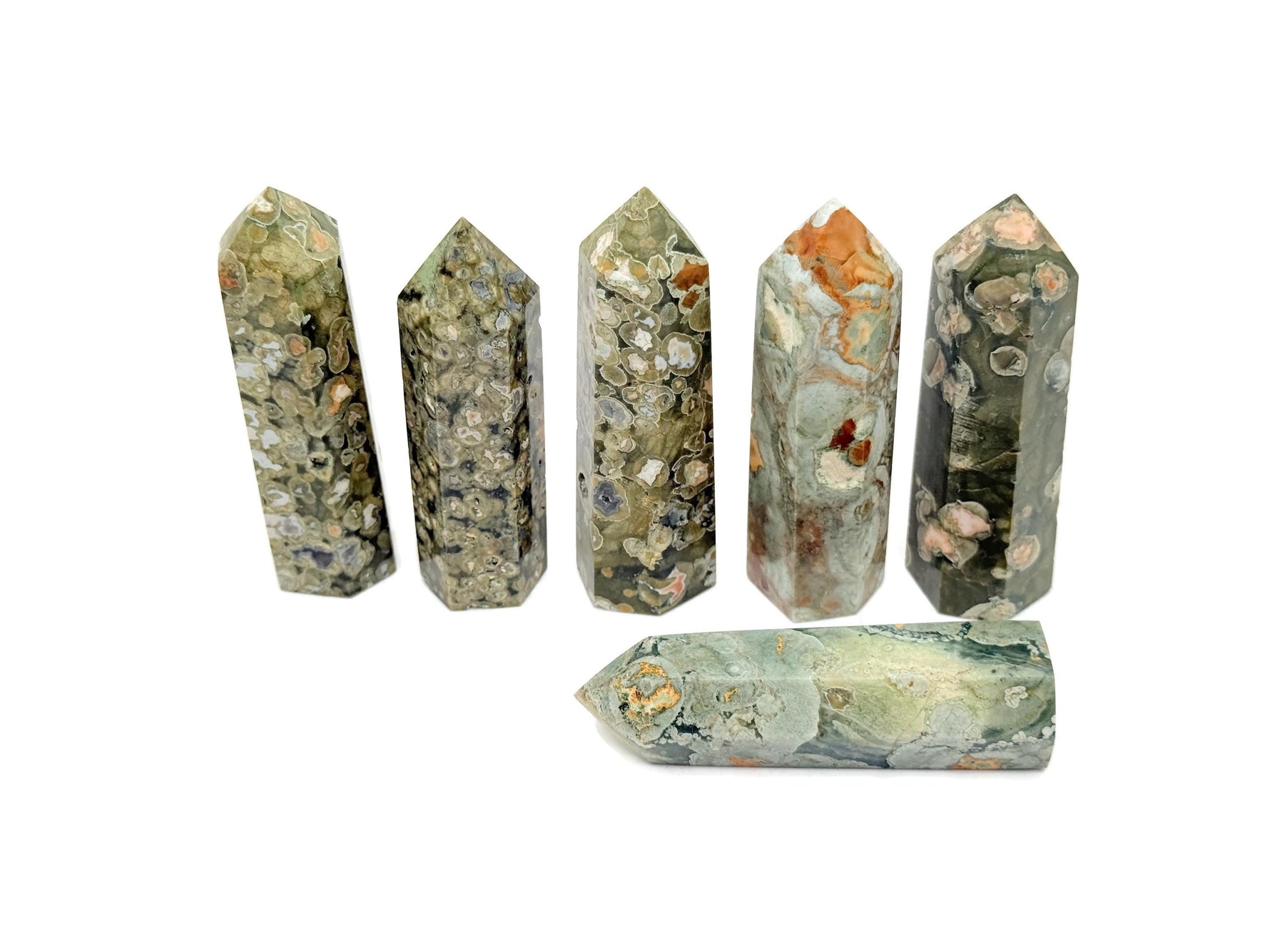 Rhyolite Obelisk Tower crystal from GemstoneGO featuring a rainforest green hue and polished gemstone surface.