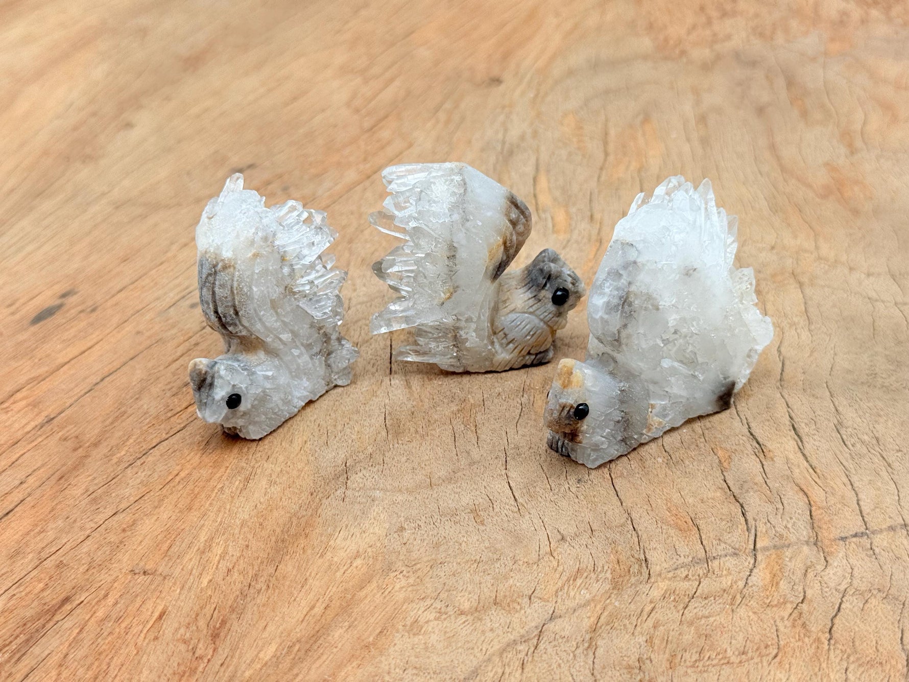 Squirrel-shaped quartz gemstone carving by GemstoneGO, detailed squirrel design in polished clear quartz stone.