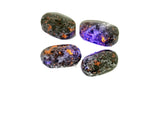 Yooperlite palm gemstone displaying fluorescent sodalite spa stone with vibrant blue glow, perfect for meditation and relaxation.