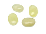 Citrine palm gemstone spa stone from GemstoneGO, natural yellow-orange healing stone with smooth surface, used for relaxation and massage.