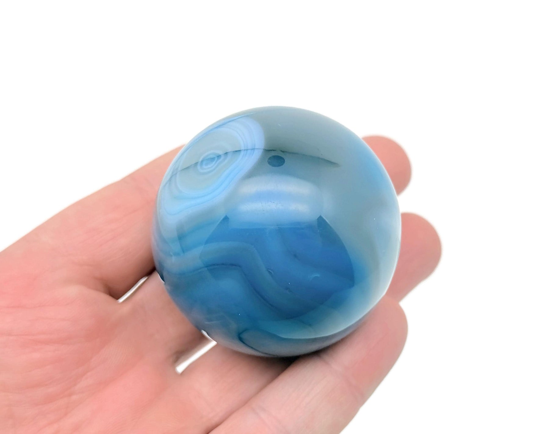 Blue Agate gemstone sphere, 50-60mm crystal ball with smooth polished surface and vibrant blue color, by GemstoneGO.
