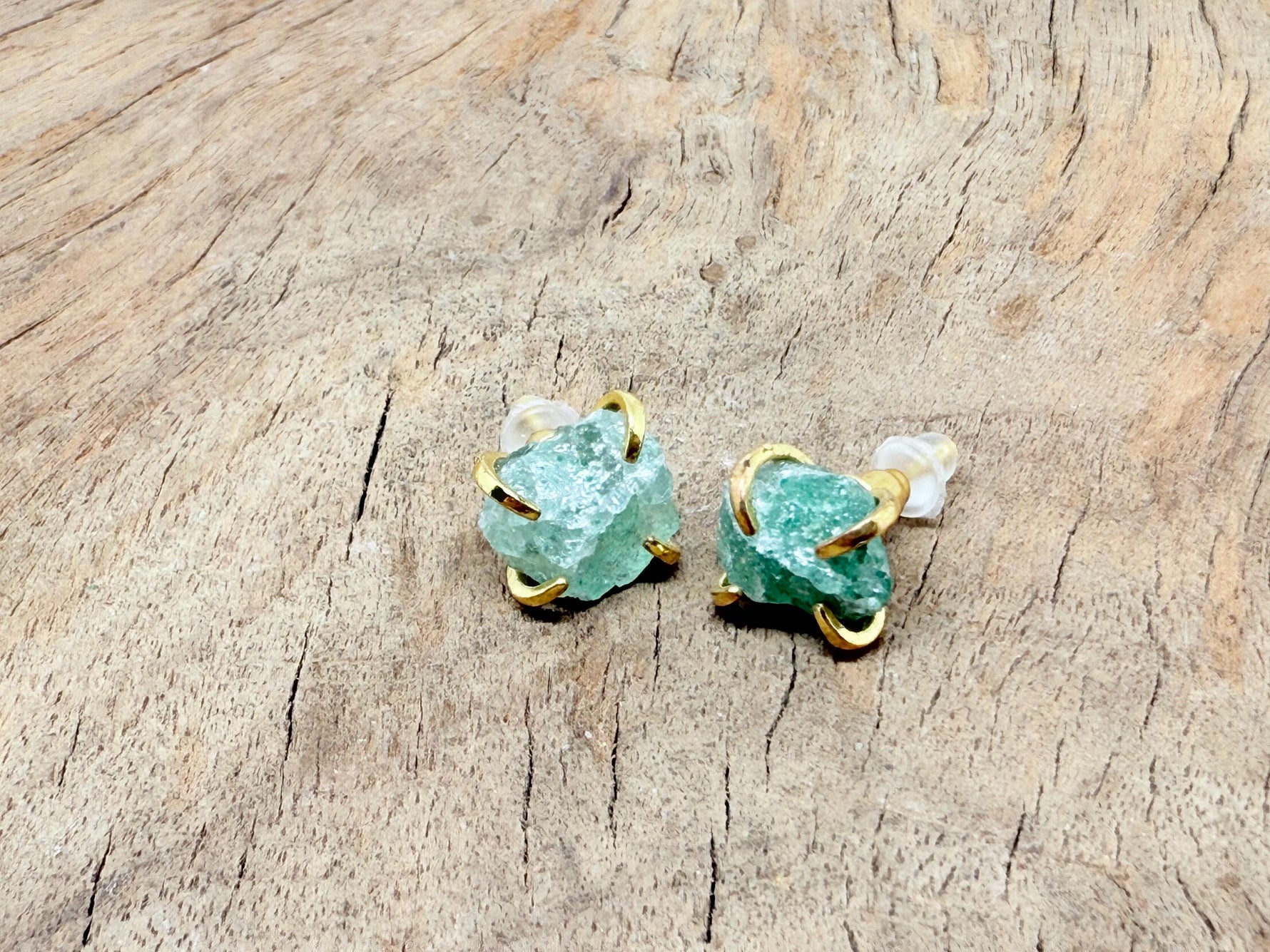 Rough crystal stud earrings with gold detailing by GemstoneGO, minimalist jewelry with natural crystal textures and gold accents.