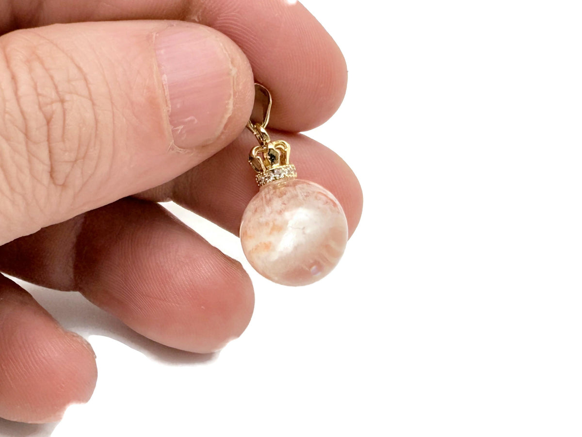 Ghost Quartz pendant from GemstoneGO featuring a phantom crystal for spiritual growth and healing, shown hanging on a chain.