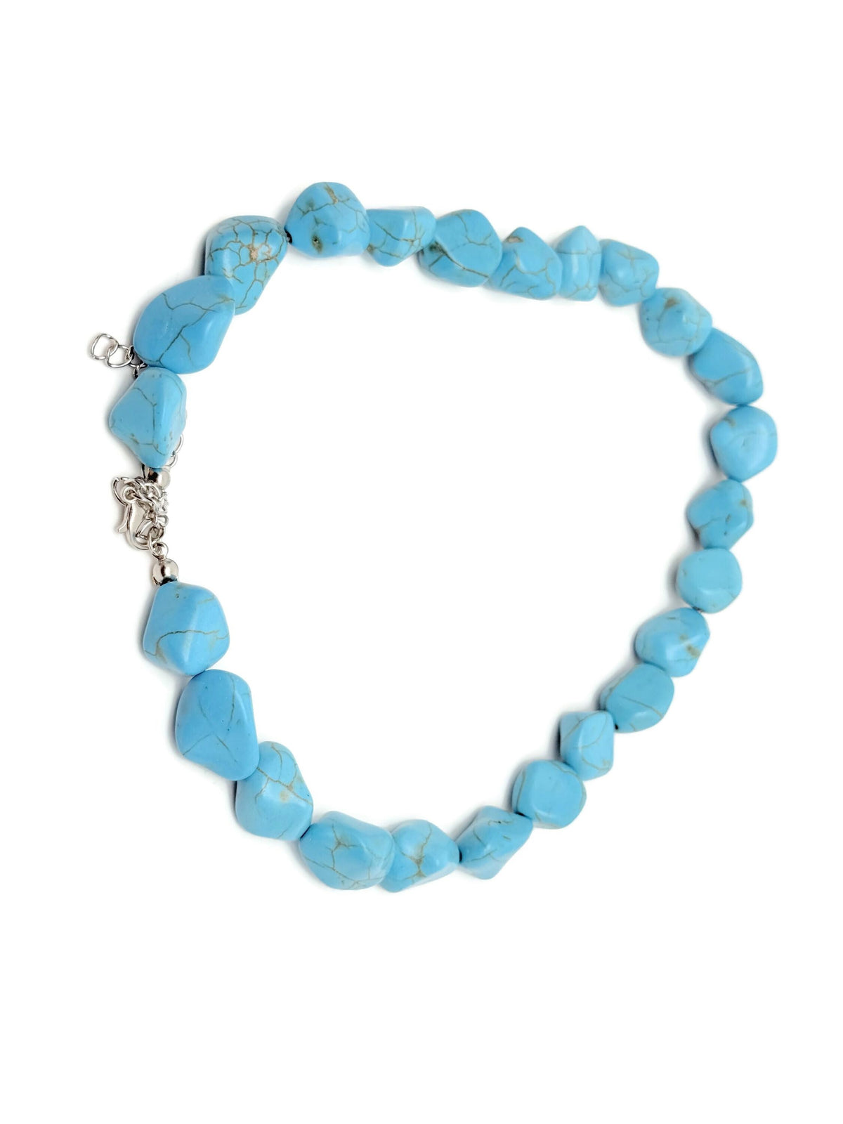 Turquoise jewelry set with crystal accents, including necklace and earrings, by GemstoneGO, showcasing vibrant turquoise stones and elegant design.