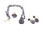 Handmade boho chic amethyst jewelry set featuring earrings and necklace from GemstoneGO, with polished purple amethyst stones.