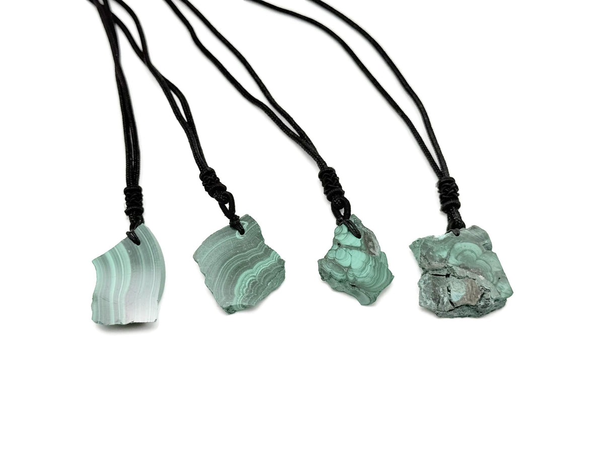 Malachite crystal necklace with adjustable cord from GemstoneGO, featuring a polished green gemstone pendant on a black cord.