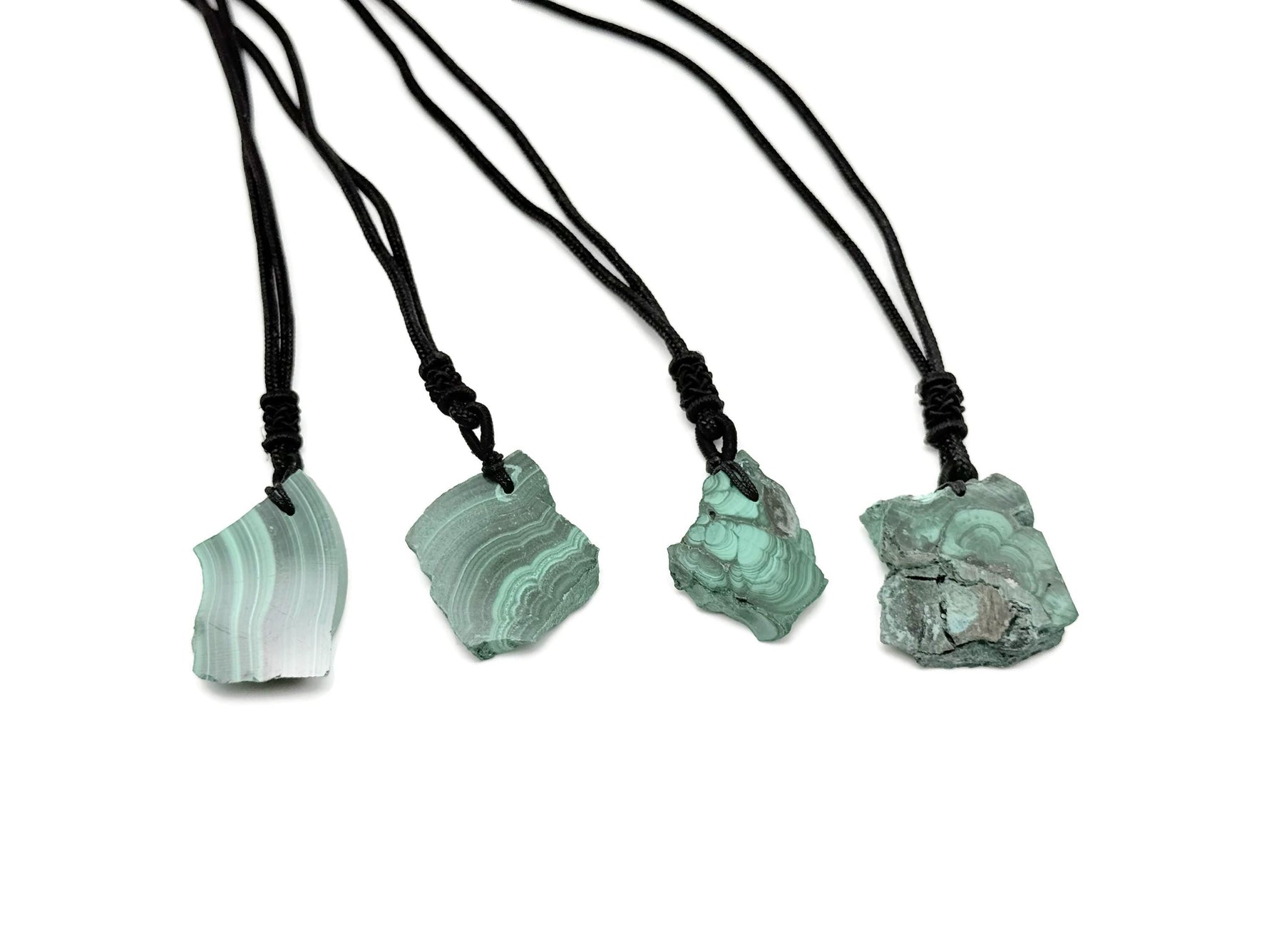 Malachite crystal necklace with adjustable cord from GemstoneGO, featuring a polished green gemstone pendant on a black cord.