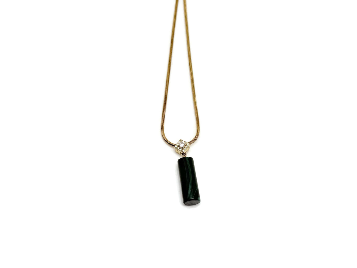 Malachite cylinder crystal necklace with gold chain from GemstoneGO, featuring a polished green stone pendant for protection and power.