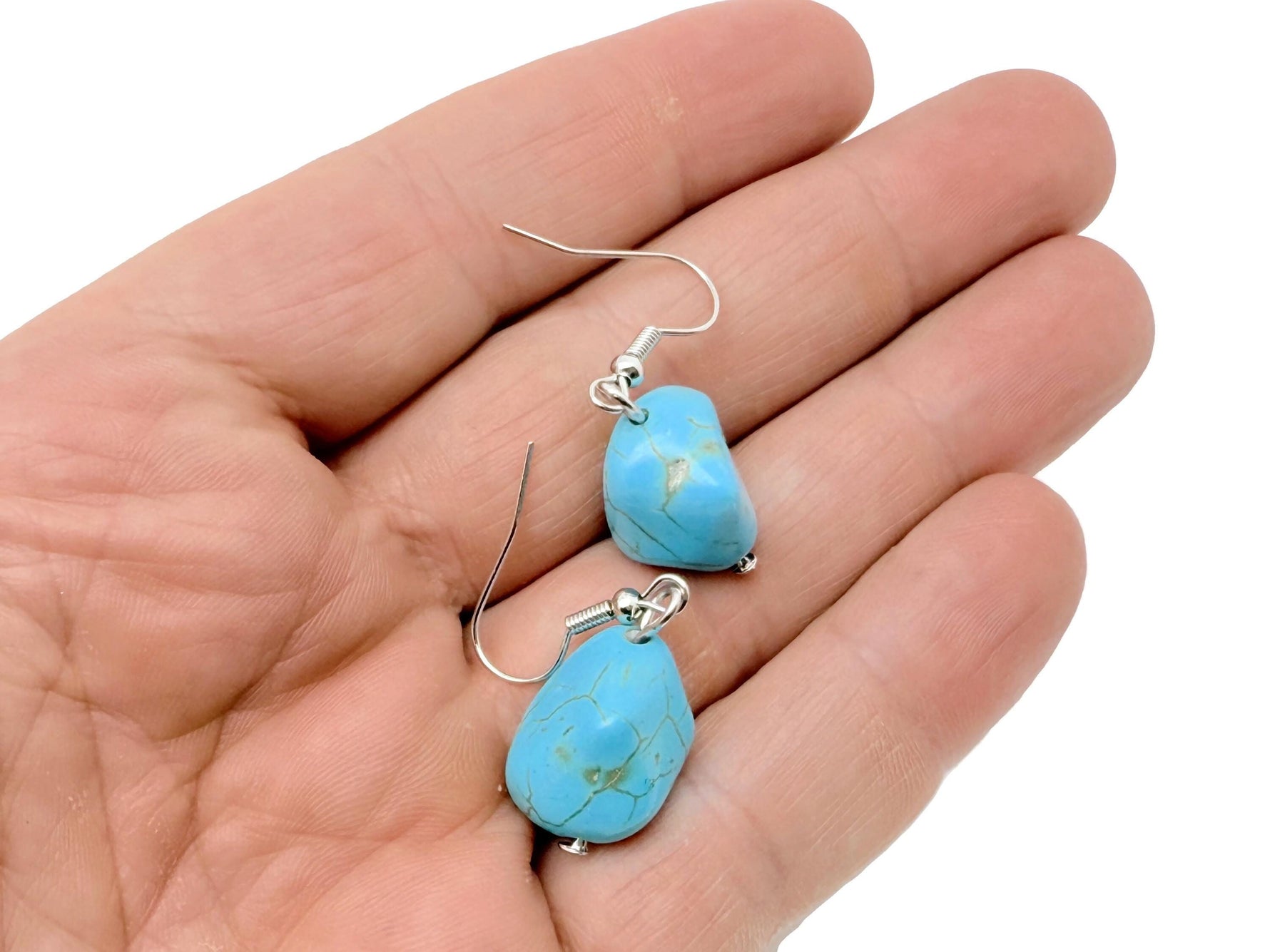 Turquoise jewelry set with crystal accents from GemstoneGO, includes matching necklace and earrings, displayed on a neutral background.